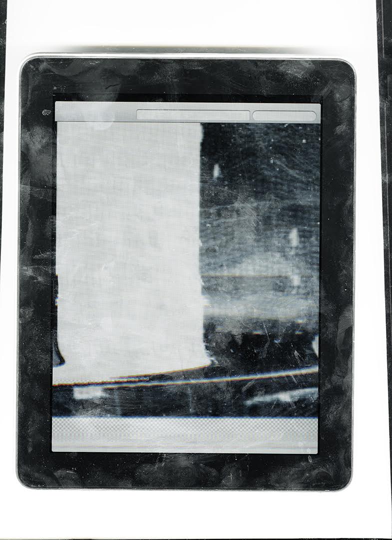 Framed tablet interface with central rectangular field and smudged surface